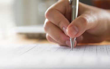 hand-writing-paper-with-pen-1-1024x643