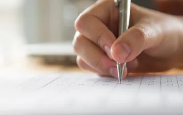 hand-writing-paper-with-pen-1-1024x643